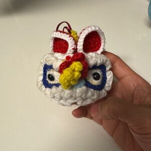 handmade crochet ornament inspired by the traditional Chinese Lion Dance costume